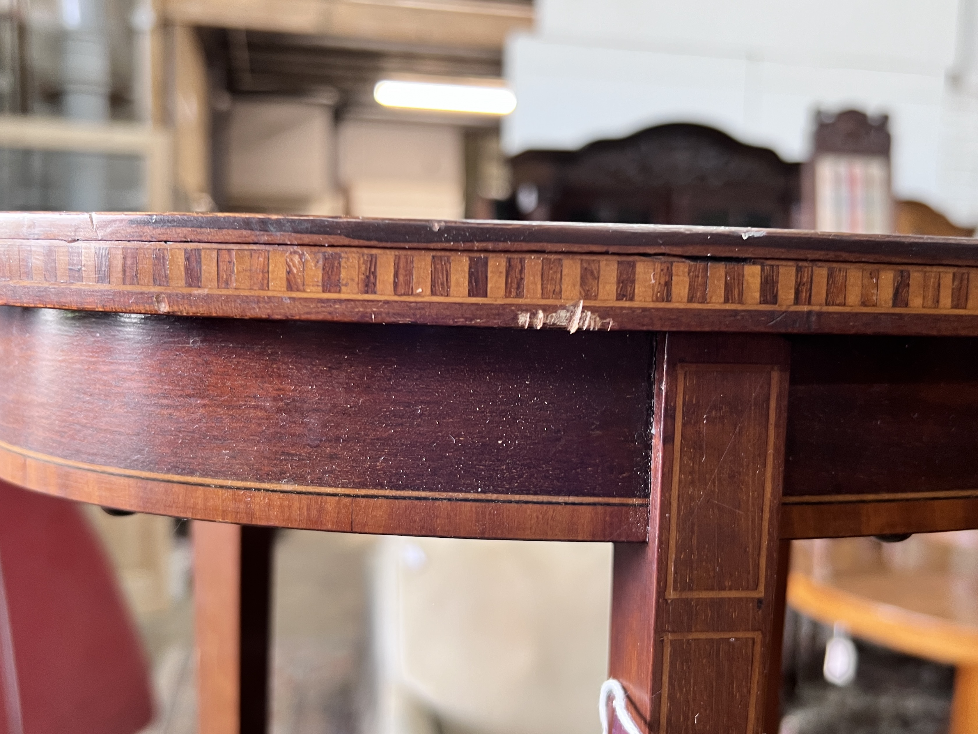 An Edwardian oval inlaid mahogany occasional table, width 61cm, depth 38cm, height 71cm